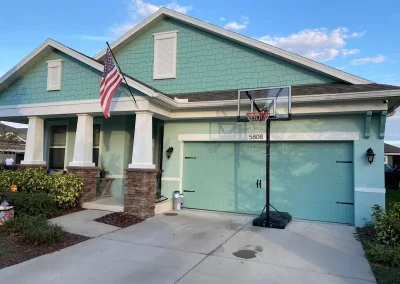 residential exterior painting project teal and white house